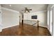 Bonus room with hardwood floors, built-in shelving and balcony access at 3633 Habersham Rd, Atlanta, GA 30305