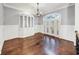 Elegant dining room with hardwood floors, built-in shelving, and chandelier at 3633 Habersham Rd, Atlanta, GA 30305