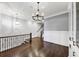 Elegant dining room with hardwood floors, built-in shelving, and chandelier at 3633 Habersham Rd, Atlanta, GA 30305