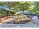 Landscaped courtyard with trees, gravel paths, and manicured lawn at 3633 Habersham Rd, Atlanta, GA 30305