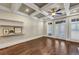 Living room with hardwood floors, coffered ceiling, and French doors at 3633 Habersham Rd, Atlanta, GA 30305