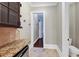 Walk-in pantry with granite countertop and additional storage at 3633 Habersham Rd, Atlanta, GA 30305