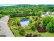 Aerial view of community with pond and lush greenery at 5649 Cobblestone Creek Pl # 13, Mableton, GA 30126