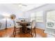 Dining area with hardwood floors and a square wooden table at 5649 Cobblestone Creek Pl # 13, Mableton, GA 30126