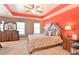 Main bedroom featuring a king-size bed and accent wall at 5649 Cobblestone Creek Pl # 13, Mableton, GA 30126