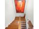 Elegant staircase with hardwood treads and modern artwork at 5649 Cobblestone Creek Pl # 13, Mableton, GA 30126