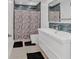 Modern bathroom with marble-patterned shower curtain and sleek vanity at 1075 Peachtree Ne Walk # A421, Atlanta, GA 30309