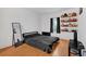 Bedroom with wood floors, natural light and sneaker display at 1075 Peachtree Ne Walk # A421, Atlanta, GA 30309