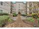 Beautiful courtyard with seating and lush greenery at 1075 Peachtree Ne Walk # A421, Atlanta, GA 30309