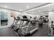 Well-equipped fitness center featuring treadmills, elliptical machines, and a full-length mirror for your workout needs at 1075 Peachtree Ne Walk # A421, Atlanta, GA 30309