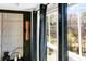 Bedroom with large windows, dark blue curtains, and a view of the trees outside at 2505 Astaire Nw Ct, Atlanta, GA 30318