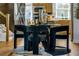 Stylish dining area with dark blue velvet chairs and glass top table at 2505 Astaire Nw Ct, Atlanta, GA 30318