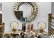 Stylish foyer with a unique mirror, decorative table, and elegant staircase at 2505 Astaire Nw Ct, Atlanta, GA 30318