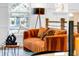 Comfortable living room with orange striped couch and floor lamp at 2505 Astaire Nw Ct, Atlanta, GA 30318