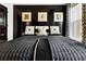 Black and white bedroom with large bed and window at 2505 Astaire Nw Ct, Atlanta, GA 30318