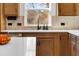 Kitchen with white quartz countertops and a farmhouse sink at 2505 Astaire Nw Ct, Atlanta, GA 30318