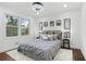 Cozy bedroom with a large window, stylish decor, and hardwood floors, creating a comfortable retreat at 2724 Larkspur Se Dr, Atlanta, GA 30316