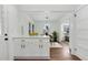 Open dining area features white cabinets, sleek lighting, and seamless flow to other living spaces at 2724 Larkspur Se Dr, Atlanta, GA 30316