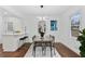 Modern dining room features contemporary lighting, hardwood floors, and sleek furniture at 2724 Larkspur Se Dr, Atlanta, GA 30316