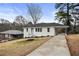 Well-maintained home with a covered carport and driveway situated on a generous lot at 2724 Larkspur Se Dr, Atlanta, GA 30316