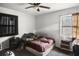 Neutral bedroom with ceiling fan, window, and medium tone carpet at 4488 Richard Rd, Conley, GA 30288