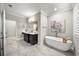 Spa-like bathroom featuring a freestanding soaking tub and a large vanity at 613 Stone Field Nw Run, Marietta, GA 30060