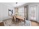 Bright dining room with hardwood floors and French doors at 613 Stone Field Nw Run, Marietta, GA 30060