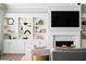 Fireplace with herringbone tile surround and built-in shelving at 613 Stone Field Nw Run, Marietta, GA 30060