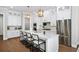 Modern white kitchen with stainless steel appliances and an island at 613 Stone Field Nw Run, Marietta, GA 30060