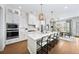 Open concept kitchen features stainless steel appliances and breakfast bar at 613 Stone Field Nw Run, Marietta, GA 30060