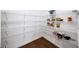 Walk-in pantry with ample shelving for storage at 613 Stone Field Nw Run, Marietta, GA 30060