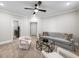 Bright sitting room with ample space and a comfortable seating arrangement at 613 Stone Field Nw Run, Marietta, GA 30060