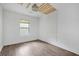 Bright bedroom with hardwood floors and wood accent wall at 1816 Evans Dr, Atlanta, GA 30310