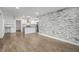 Open living area with wood floors and stone accent wall at 1816 Evans Dr, Atlanta, GA 30310