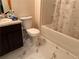 Clean bathroom with a bathtub, shower, toilet and dark brown vanity at 2169 Olmadison Vw, Atlanta, GA 30349