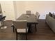 Dining room features a large dark wood table with gray chairs at 2169 Olmadison Vw, Atlanta, GA 30349