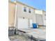 Tan colored townhome with a white garage door and small front yard at 2169 Olmadison Vw, Atlanta, GA 30349