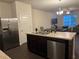 Kitchen boasts an island with a double sink and stainless steel appliances at 2169 Olmadison Vw, Atlanta, GA 30349