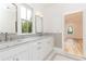 Bathroom boasts double vanity with marble countertop and subway tile at 2624 Forrest Ne Way, Atlanta, GA 30305