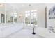 Luxurious bathroom with a freestanding soaking tub, double vanity, and herringbone tile floors at 2624 Forrest Ne Way, Atlanta, GA 30305