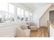 Bright sitting area with two armchairs and large windows offering ample natural light at 2624 Forrest Ne Way, Atlanta, GA 30305