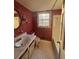 Bathroom with hex tile floor and red wallpaper at 280 E Valley Dr, Marietta, GA 30068