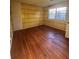 Hardwood floor bedroom with plaid wallpaper and window at 280 E Valley Dr, Marietta, GA 30068