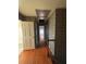 Long hallway with wood floors and patterned wallpaper at 280 E Valley Dr, Marietta, GA 30068