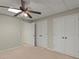 Basement bedroom featuring ceiling fan and built-in closets at 4562 Worthings Dr, Powder Springs, GA 30127