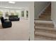 Finished basement with stairs and rec area at 4562 Worthings Dr, Powder Springs, GA 30127