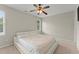 Bright bedroom with ceiling fan, large bed, and neutral decor at 4562 Worthings Dr, Powder Springs, GA 30127