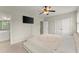 Spacious bedroom with ensuite bathroom and large TV at 4562 Worthings Dr, Powder Springs, GA 30127