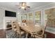 Elegant dining room with a large table and hardwood floors at 4562 Worthings Dr, Powder Springs, GA 30127