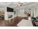 Living room with hardwood floors, fireplace, and built-in shelving at 4562 Worthings Dr, Powder Springs, GA 30127